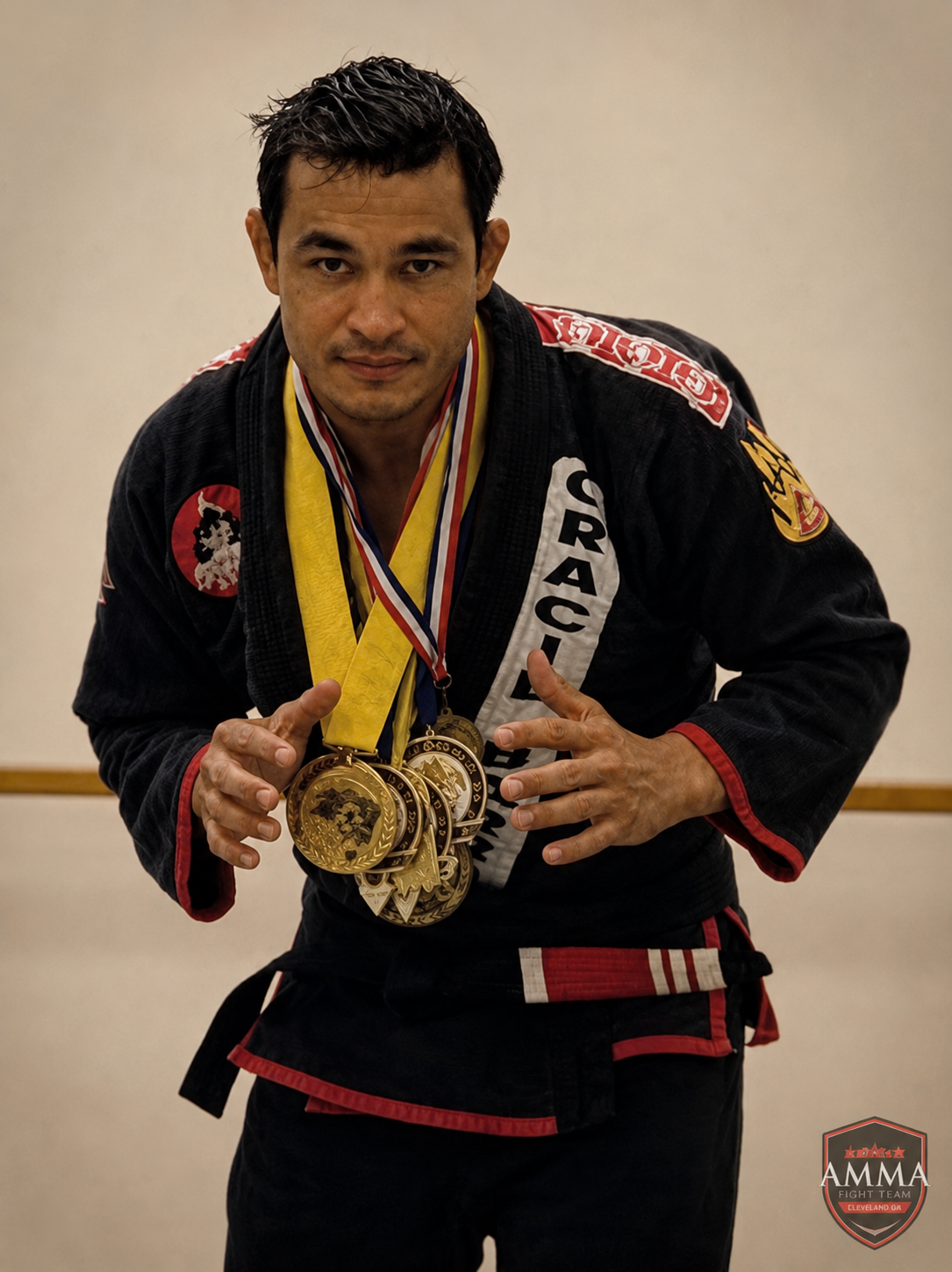 Coach Kazeka Muniz with championship medals